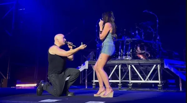 Disturbed frontman proposes onstage mid-set — and she’s down with the sickness